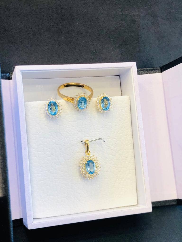Gold blue topaz ring, earrings and pendant set